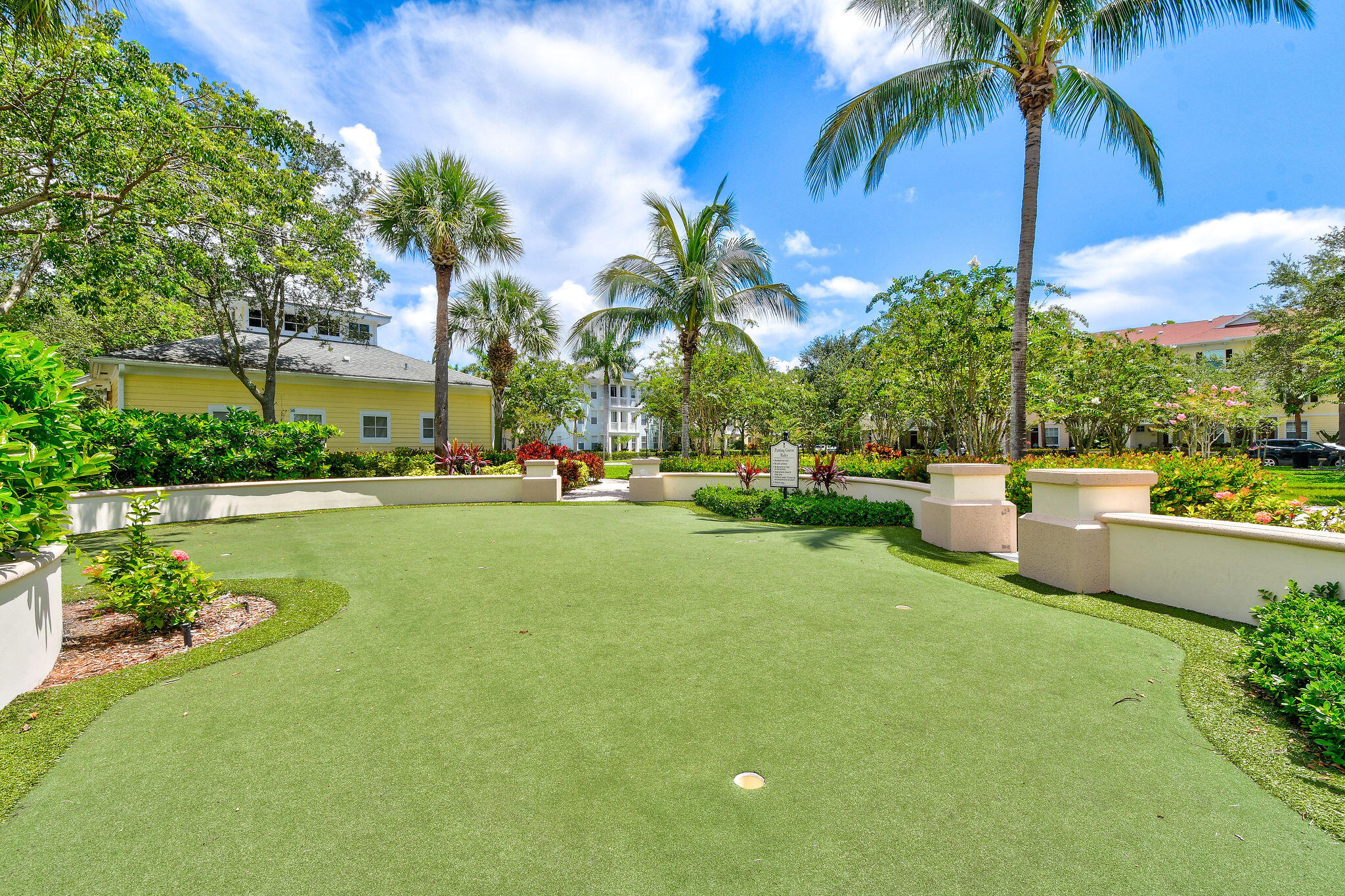 175 Galicia Way, Unit 211 Jupiter, FL 33458 - Photo 39 of 49 a view of a swimming pool and lounge chairs