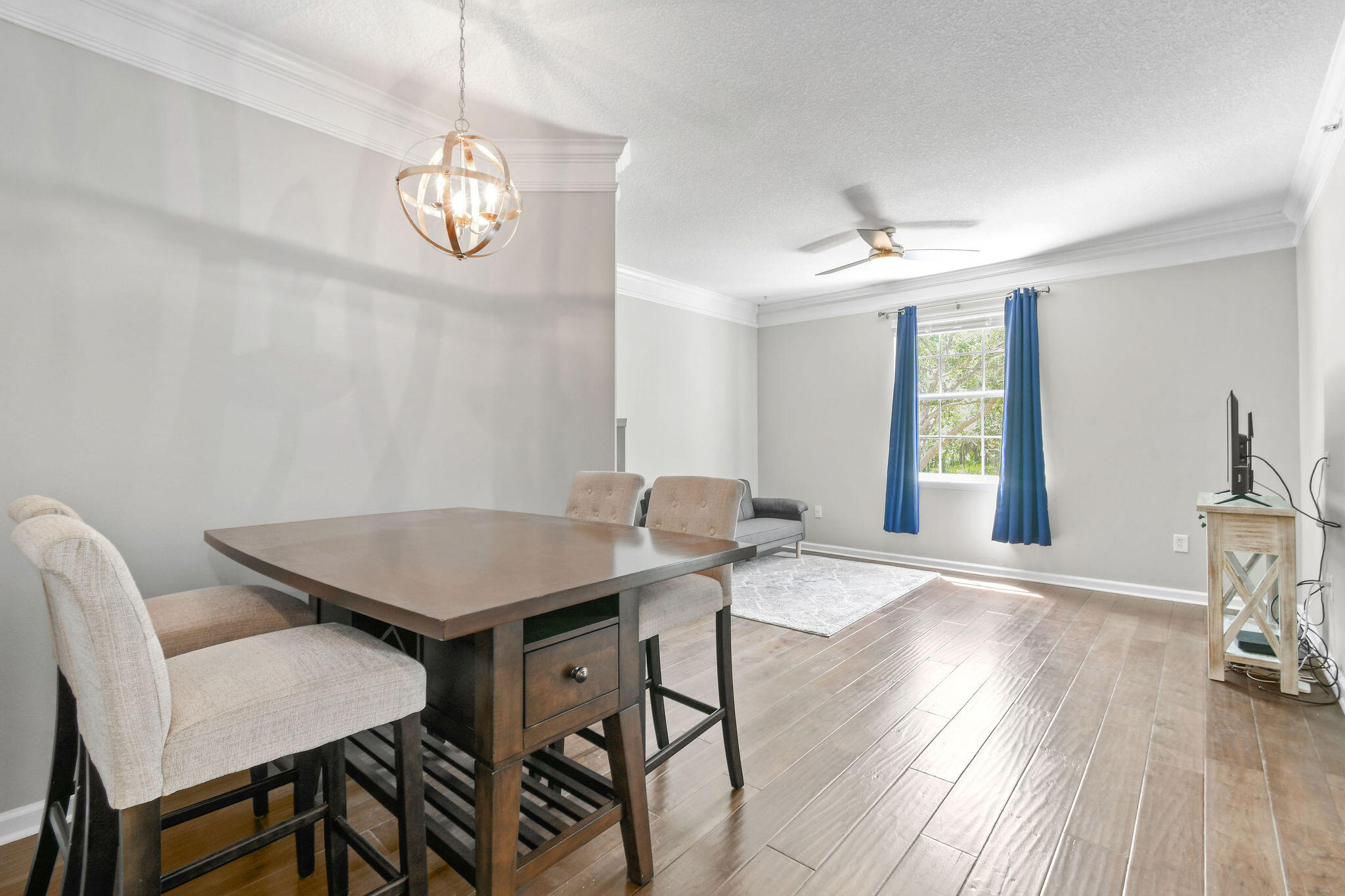 175 Galicia Way, Unit 211 Jupiter, FL 33458 - Photo 7 of 49 a view of a dining room with furniture window and wooden floor