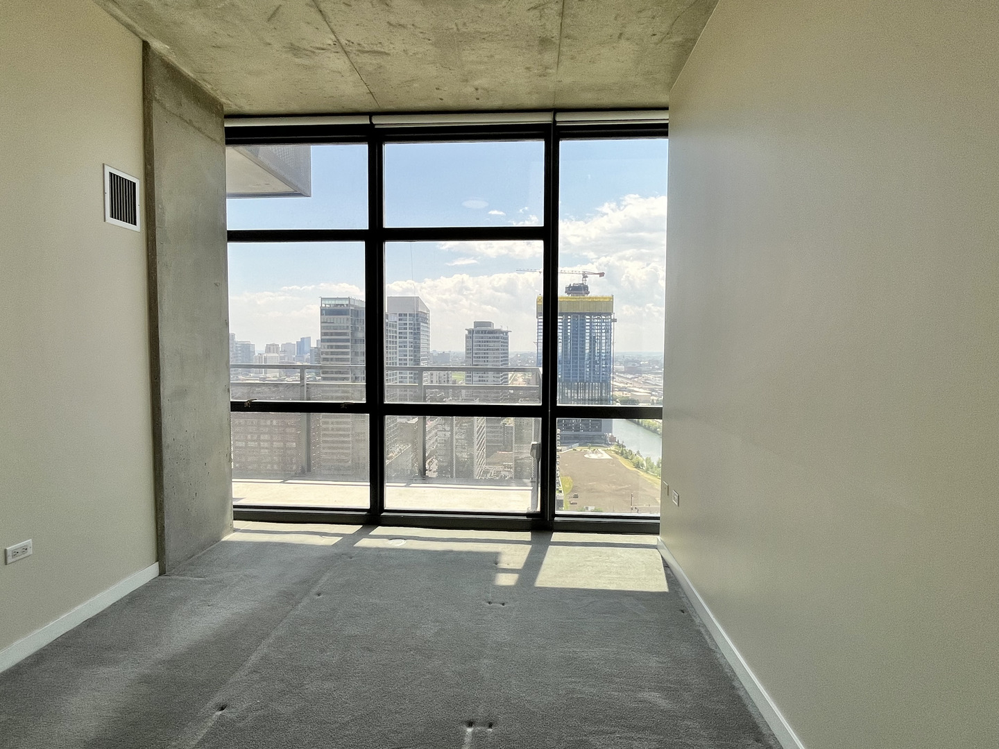 235 West Van Buren Street, Unit 2604 Chicago, IL 60607 - Photo 13 of 21 a view of an empty room with a window