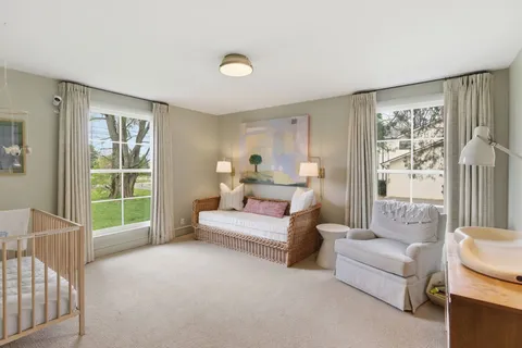 a bedroom with a bed and a couch