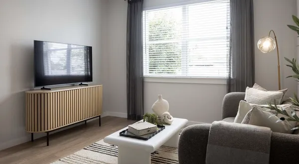 a living room with furniture and a flat screen tv