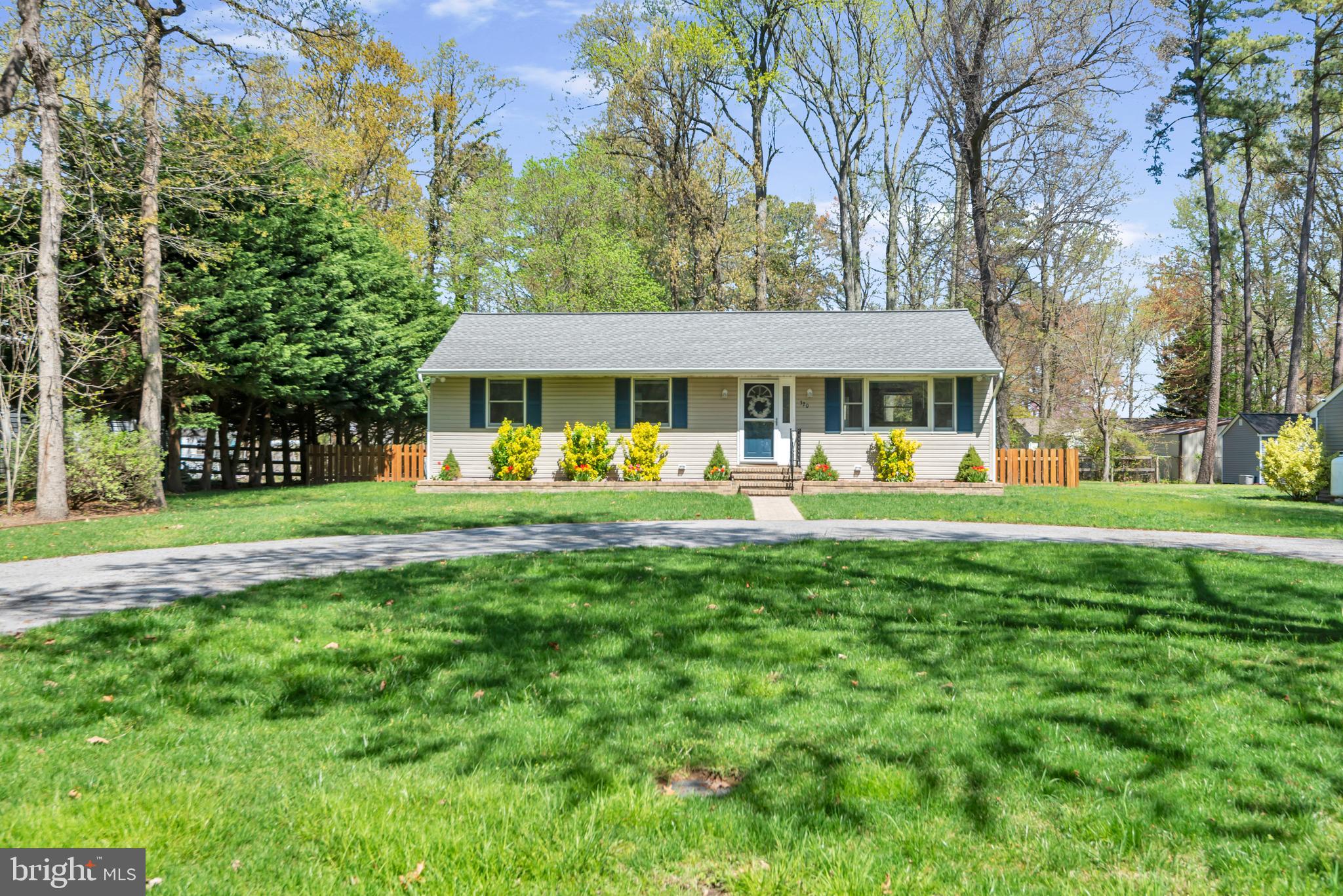320 McKay Road Stevensville, MD 21666 - Photo 2 of 48 a front view of a house with a yard table and chairs