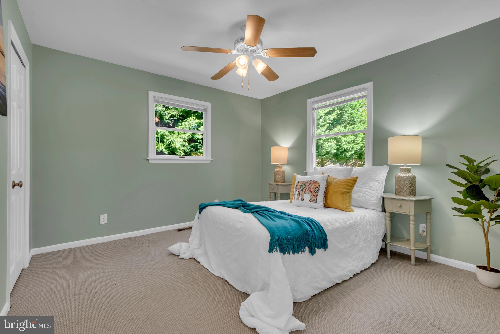 320 McKay Road Stevensville, MD 21666 - Photo 23 of 48 a bed room with a bed and a chandelier
