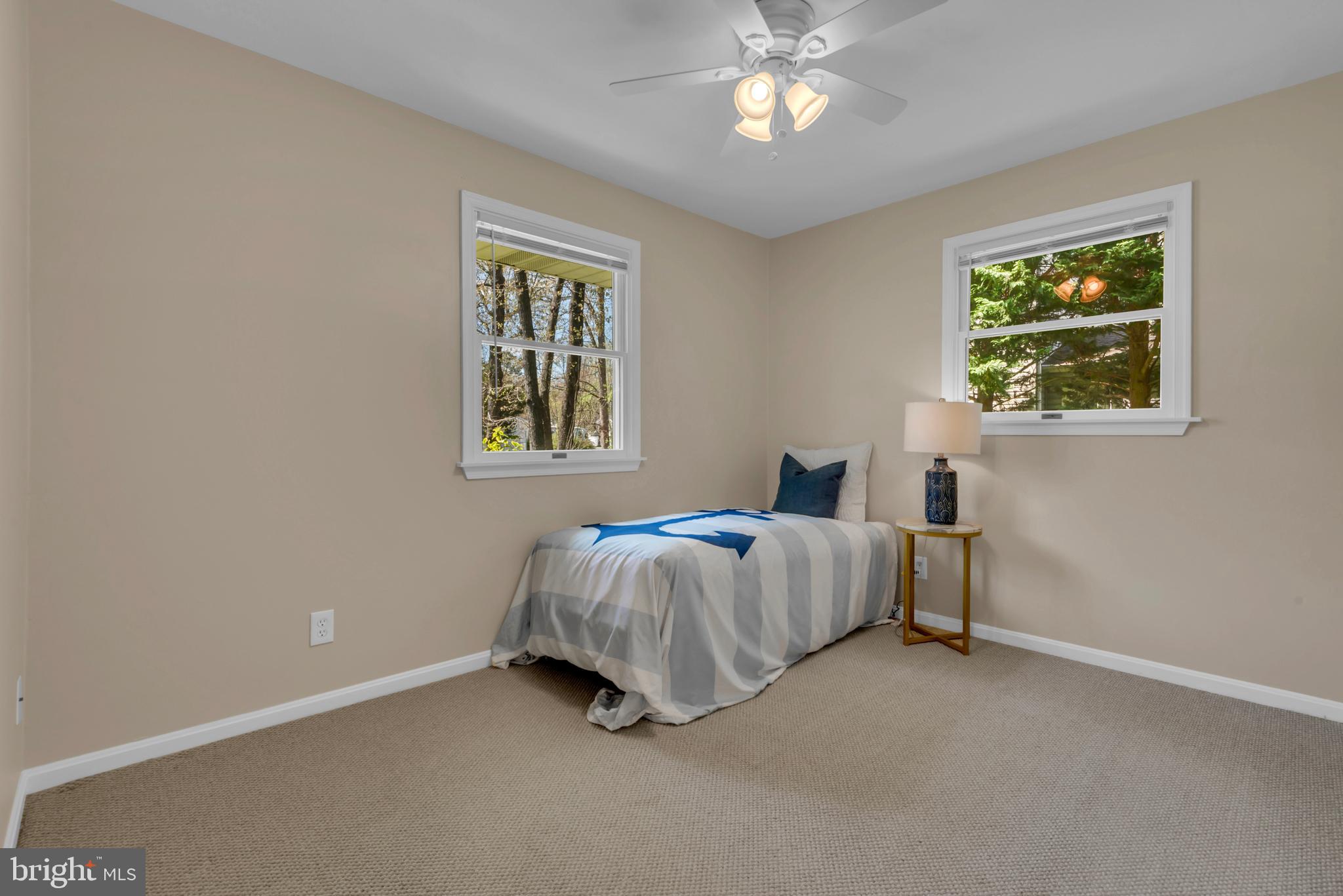 320 McKay Road Stevensville, MD 21666 - Photo 27 of 48 a spacious bedroom with a bed and a window