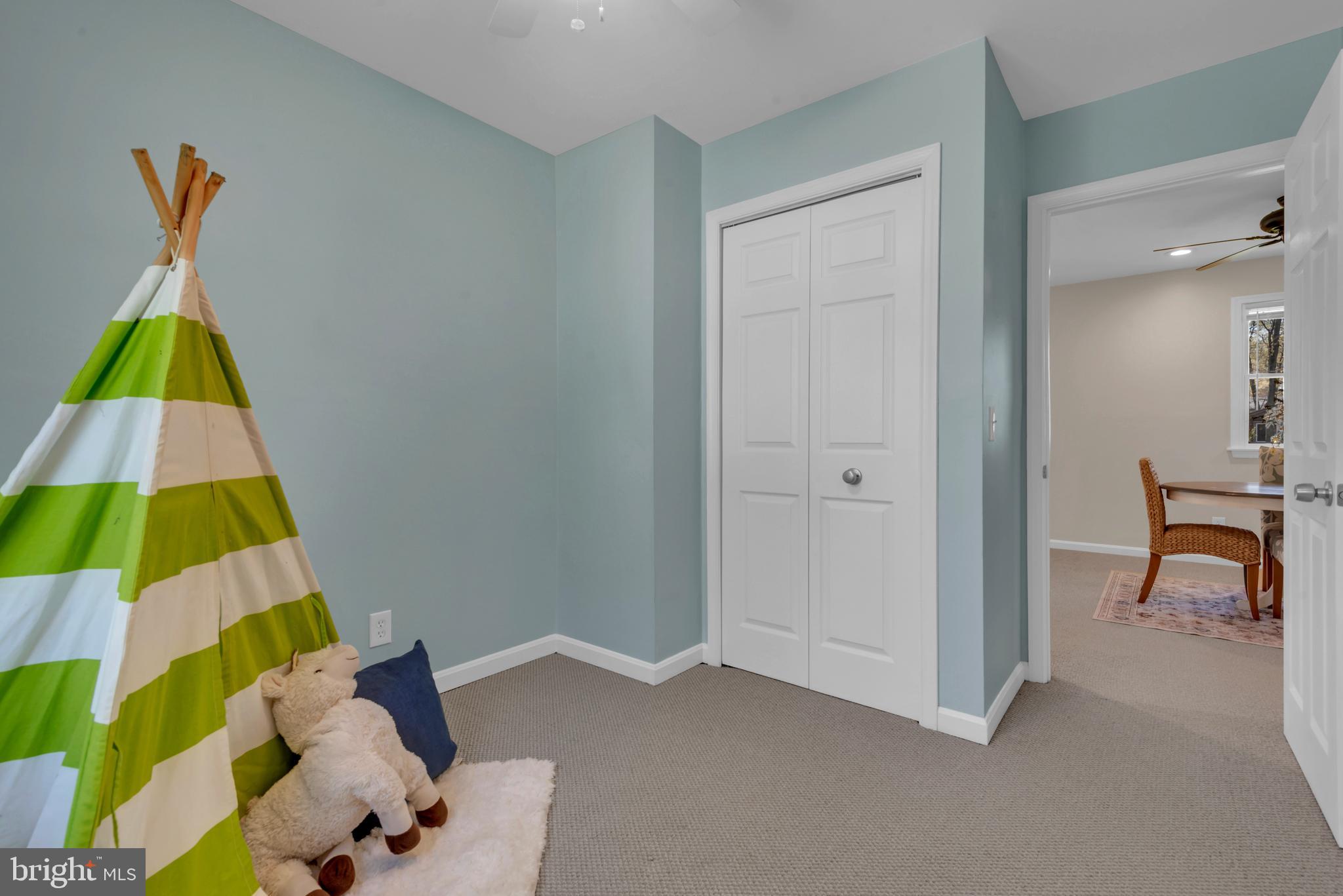 320 McKay Road Stevensville, MD 21666 - Photo 31 of 48 a room that has a bed and a table in it