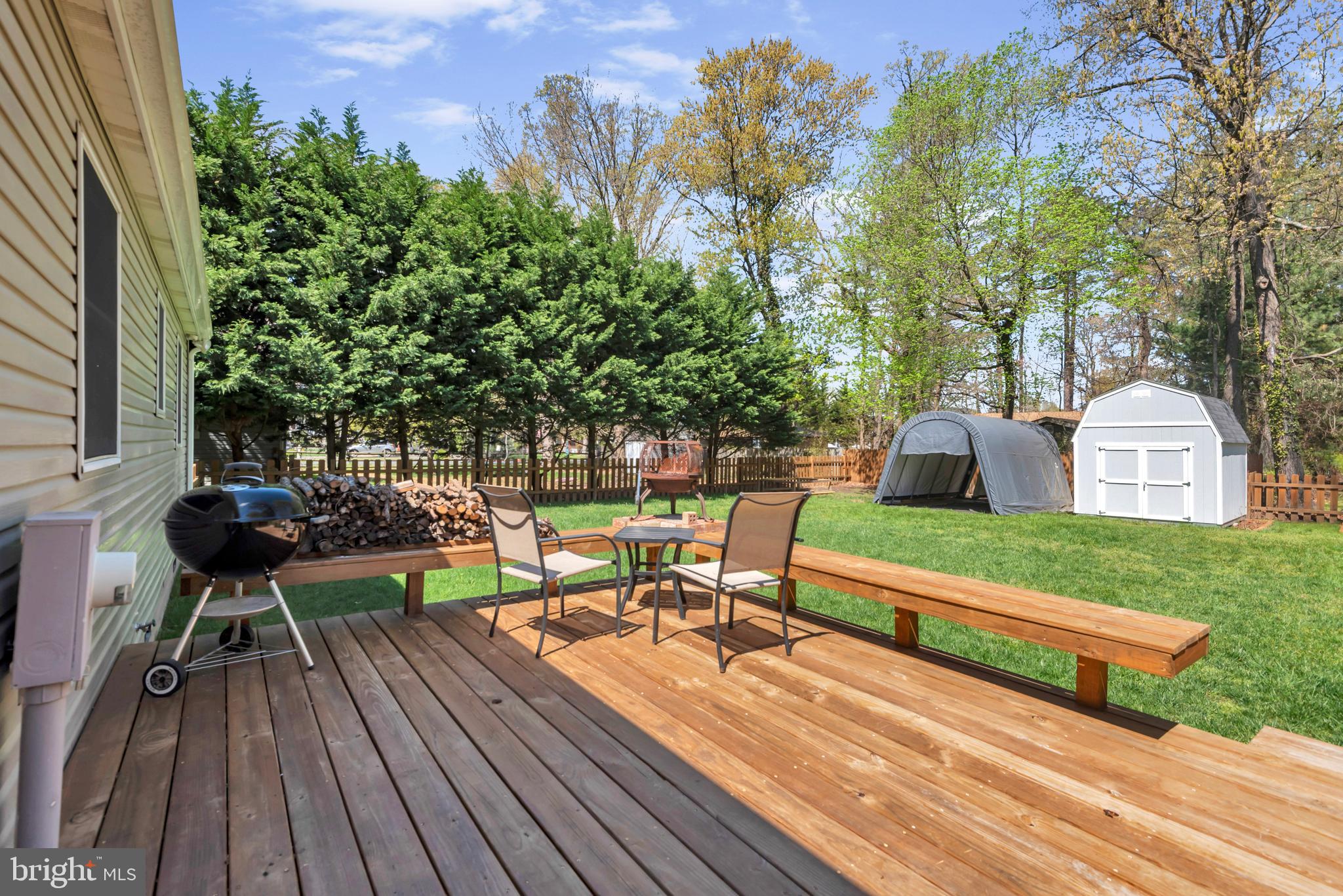 320 McKay Road Stevensville, MD 21666 - Photo 32 of 48 a view of a chairs and table on the wooden deck