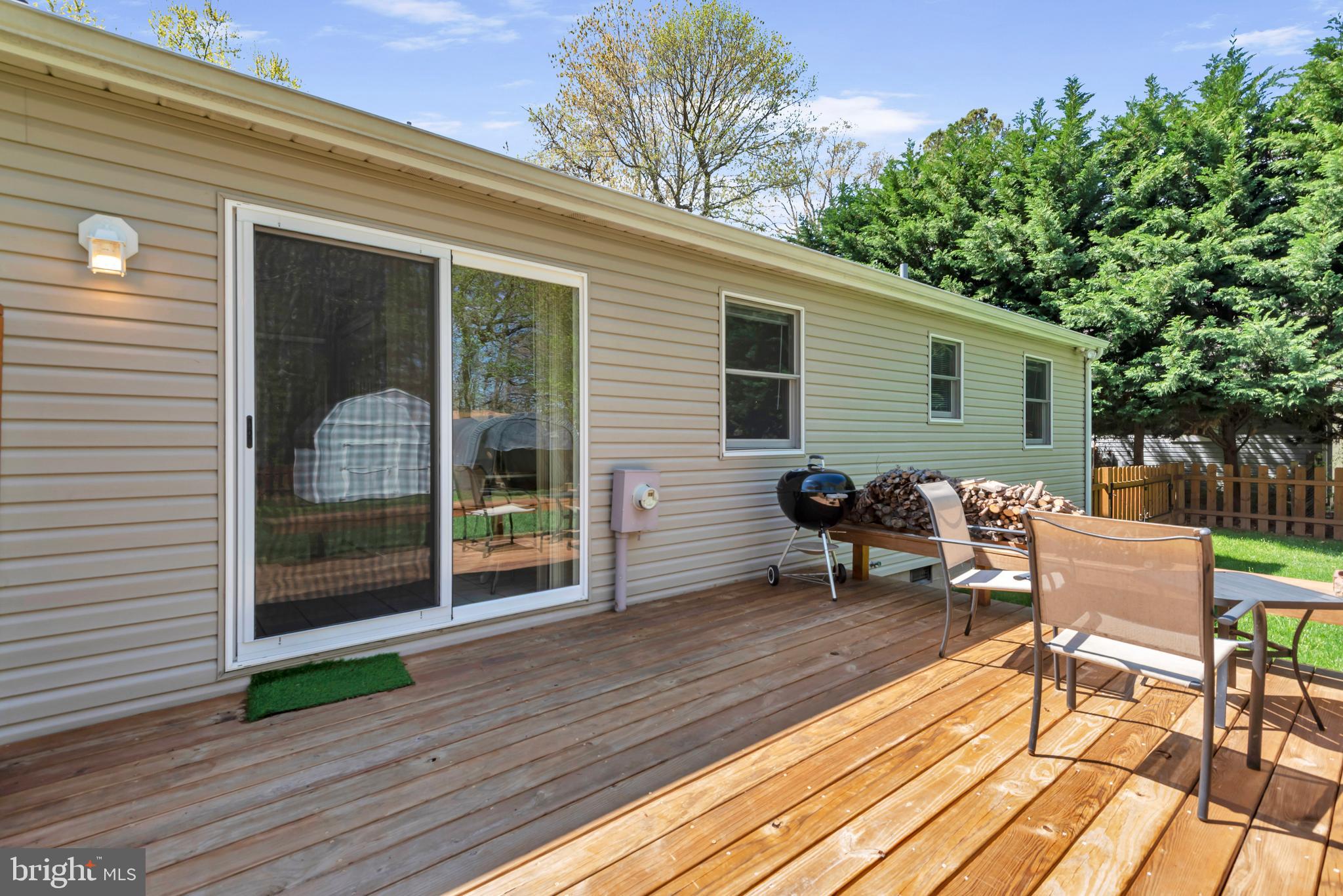 320 McKay Road Stevensville, MD 21666 - Photo 34 of 48 a view of a deck with table and chairs and wooden floor
