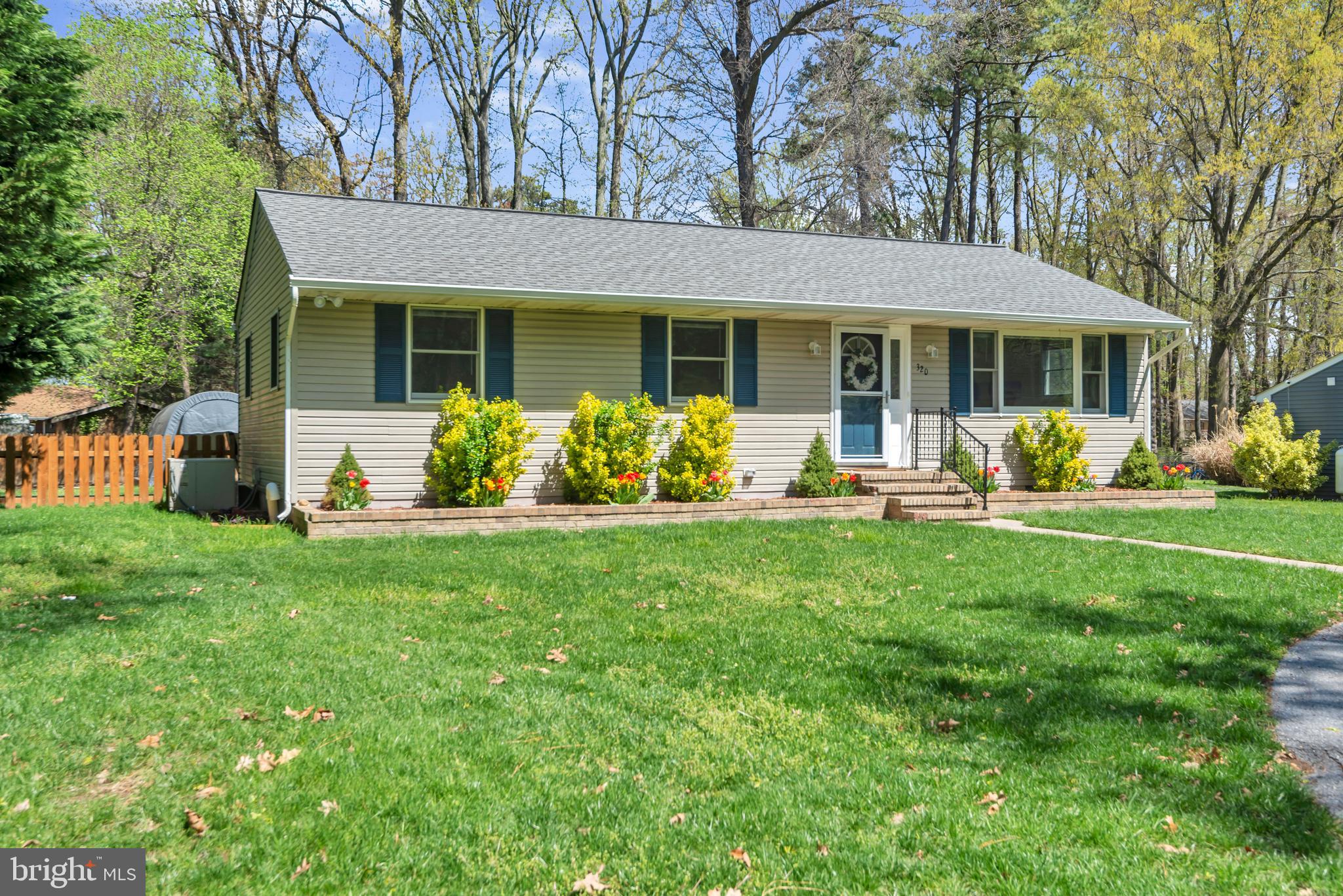 320 McKay Road Stevensville, MD 21666 - Photo 6 of 48 a front view of a house with garden
