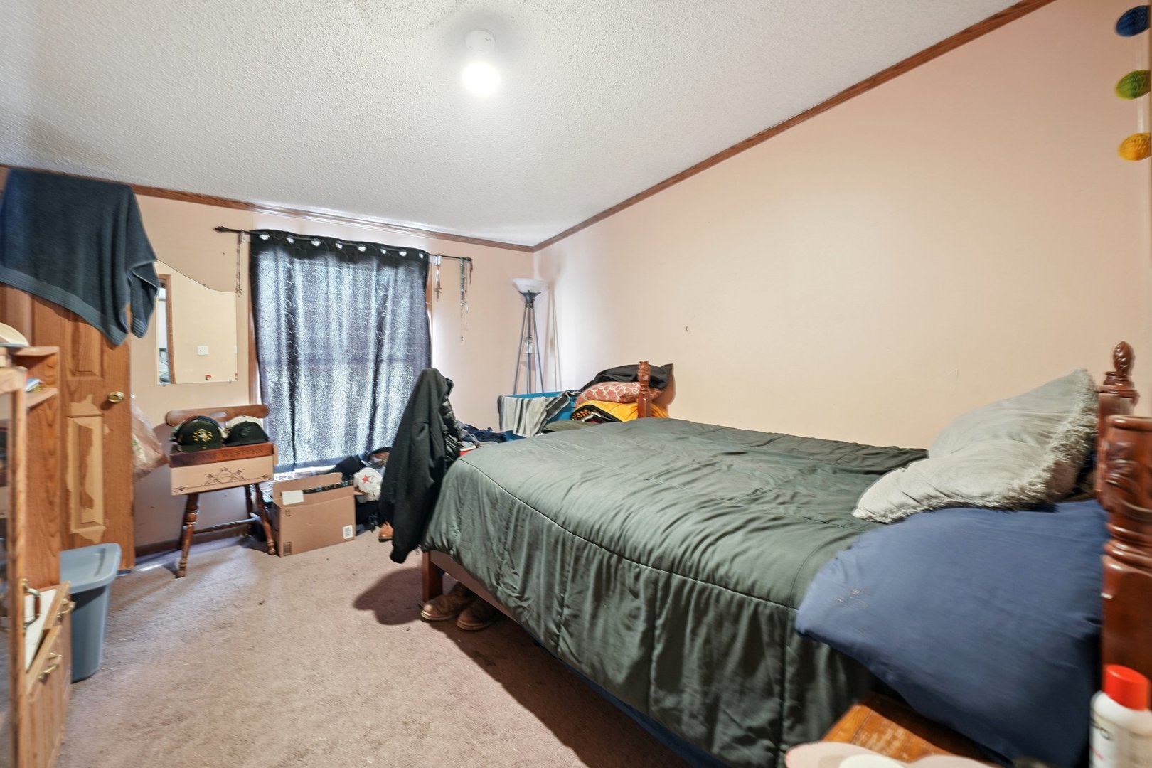 30048 South Klemme Road Beecher, IL 60401 - Photo 21 of 28 a bed sitting in a bedroom next to a window