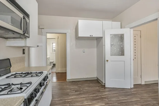 a kitchen with a stove and a refrigerator