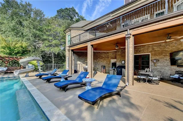 a view of a dining room with furniture wooden floor and chandelier