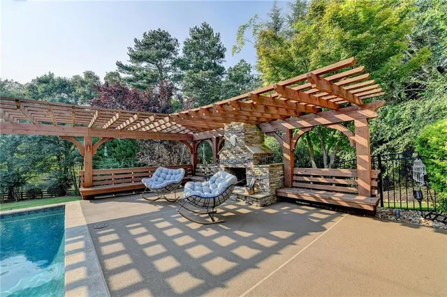 a view of a dining room with furniture wooden floor and chandelier