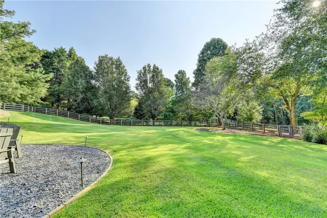 a spacious bedroom with a bed and a fireplace