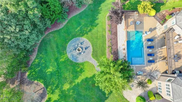 a kitchen with kitchen island granite countertop lots of counter top space and stainless steel appliances