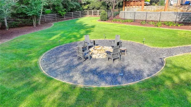 a kitchen with stainless steel appliances granite countertop a stove and cabinets