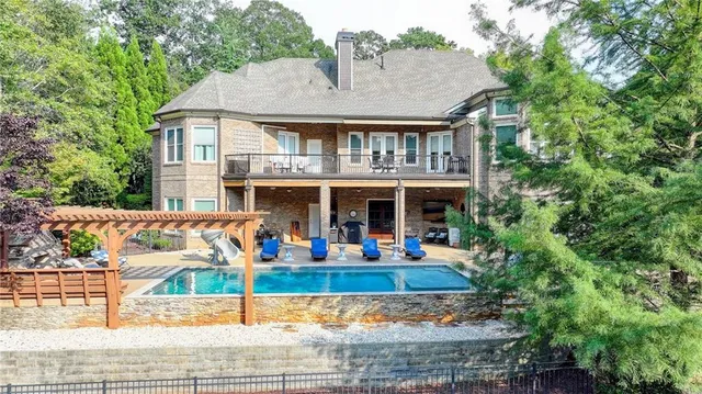 a kitchen with stainless steel appliances kitchen island granite countertop a sink and cabinets