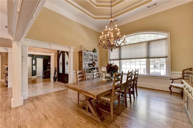 a kitchen with stainless steel appliances kitchen island granite countertop a refrigerator and microwave