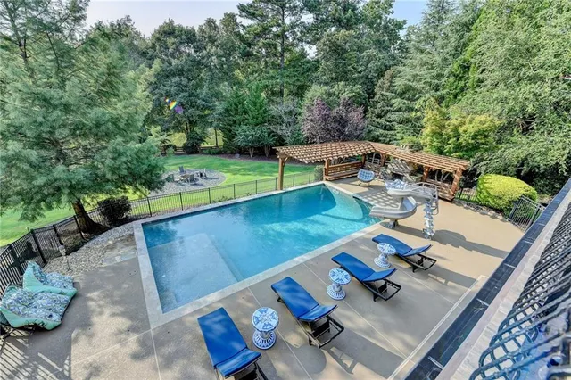 a view of a swimming pool with a patio