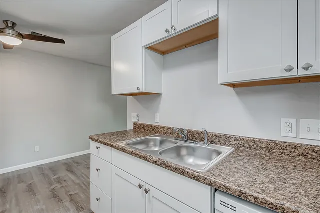 a stove top oven sitting inside of a kitchen