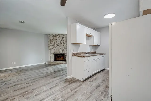 a kitchen with a cabinets and a fireplace