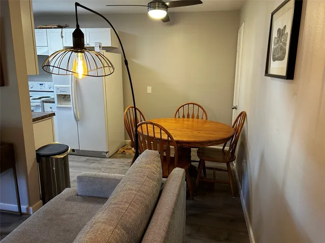 a bedroom with a large bed and a bookshelf