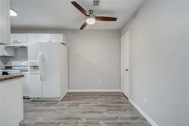 a kitchen that has a sink and a stove