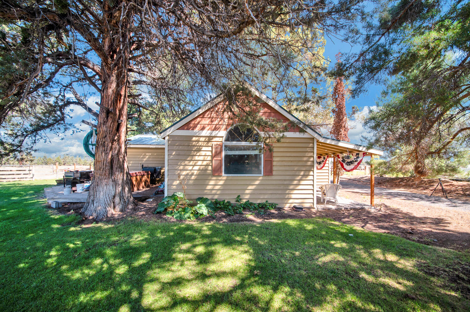 67100 Fryrear Road Bend, OR 97703 - Photo 6 of 38 a front view of a house with garden