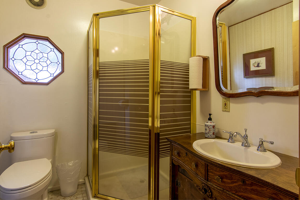 26770 Idyllwild Road Idyllwild, CA 92549 - Photo 11 of 52 a bathroom with a toilet a sink and mirror