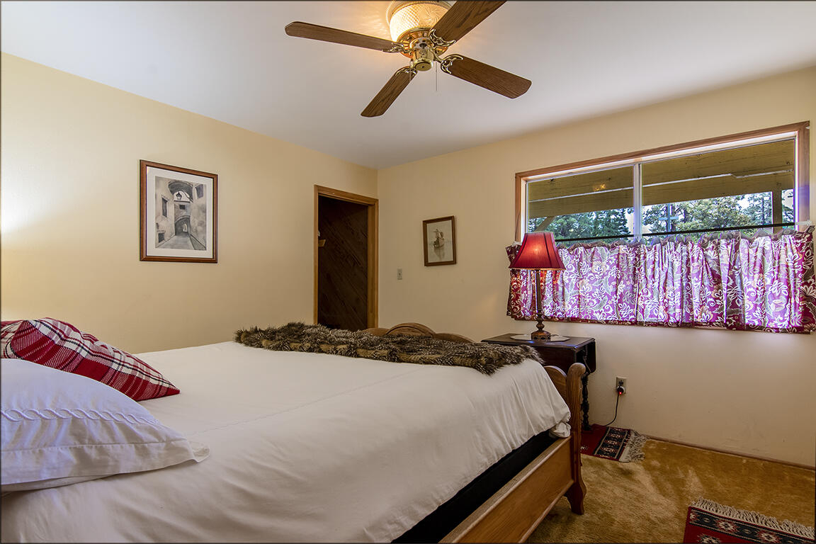 26770 Idyllwild Road Idyllwild, CA 92549 - Photo 13 of 52 a bedroom with a bed and a window