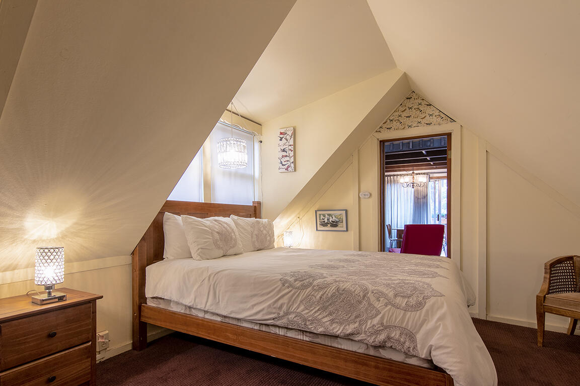 26770 Idyllwild Road Idyllwild, CA 92549 - Photo 25 of 52 a bedroom with a bed and a window