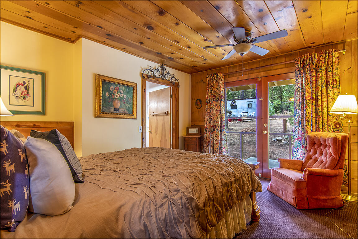 26770 Idyllwild Road Idyllwild, CA 92549 - Photo 9 of 52 a bed sitting in a spacious bedroom next to a window