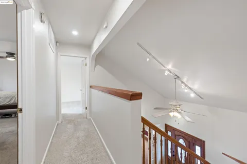 a view of a livingroom with a ceiling fan and window