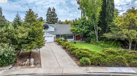 a view of a patio with table and chairs and potted plants