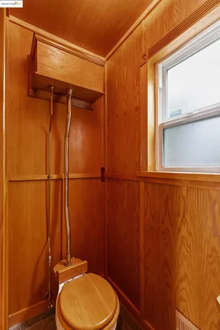 a view of a backyard with a tree