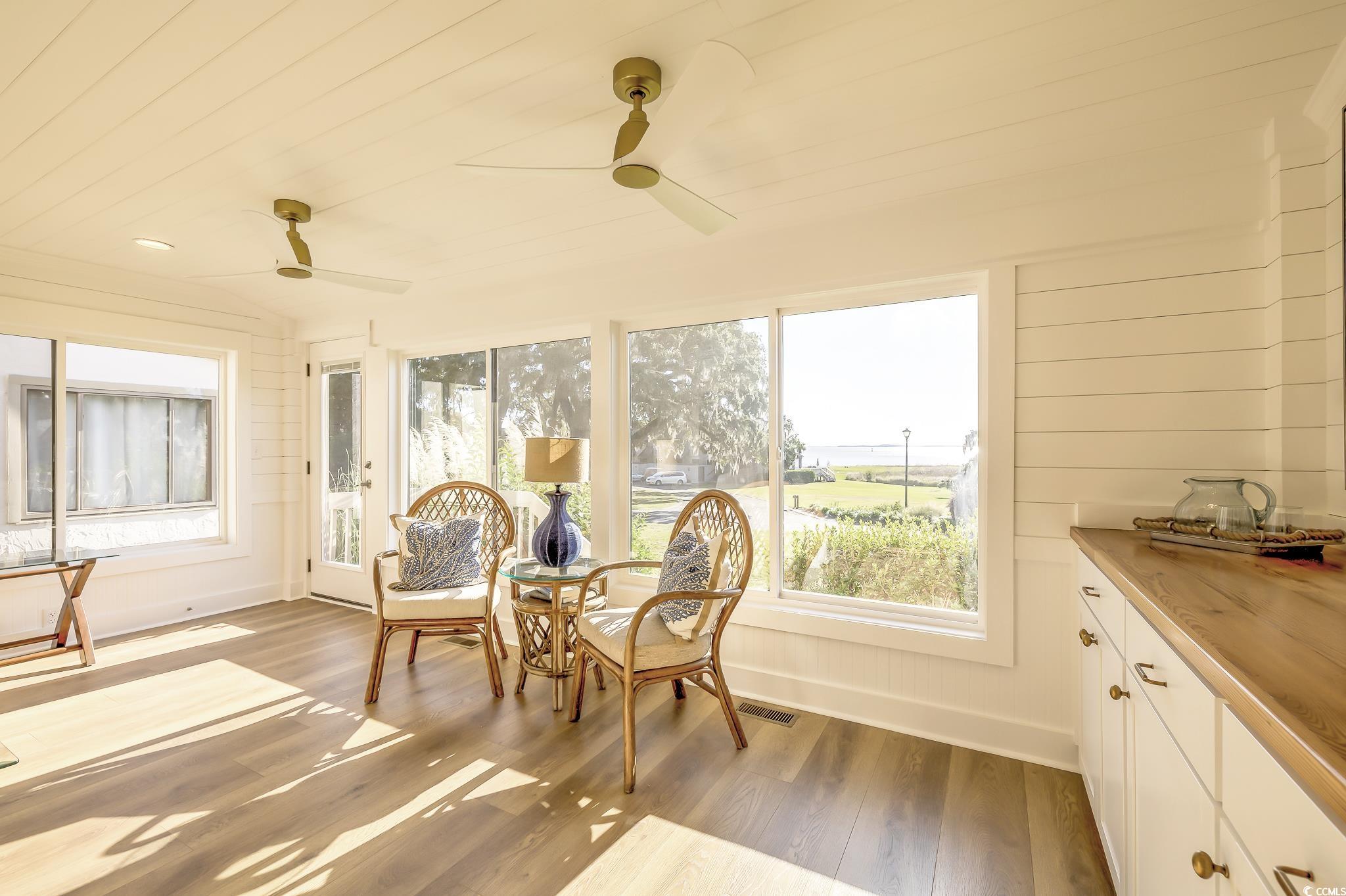204 Bamboo Loop, Unit 202 Georgetown, SC 29440 - Photo 25 of 40 Sunroom with wood finished floors and wooden walls