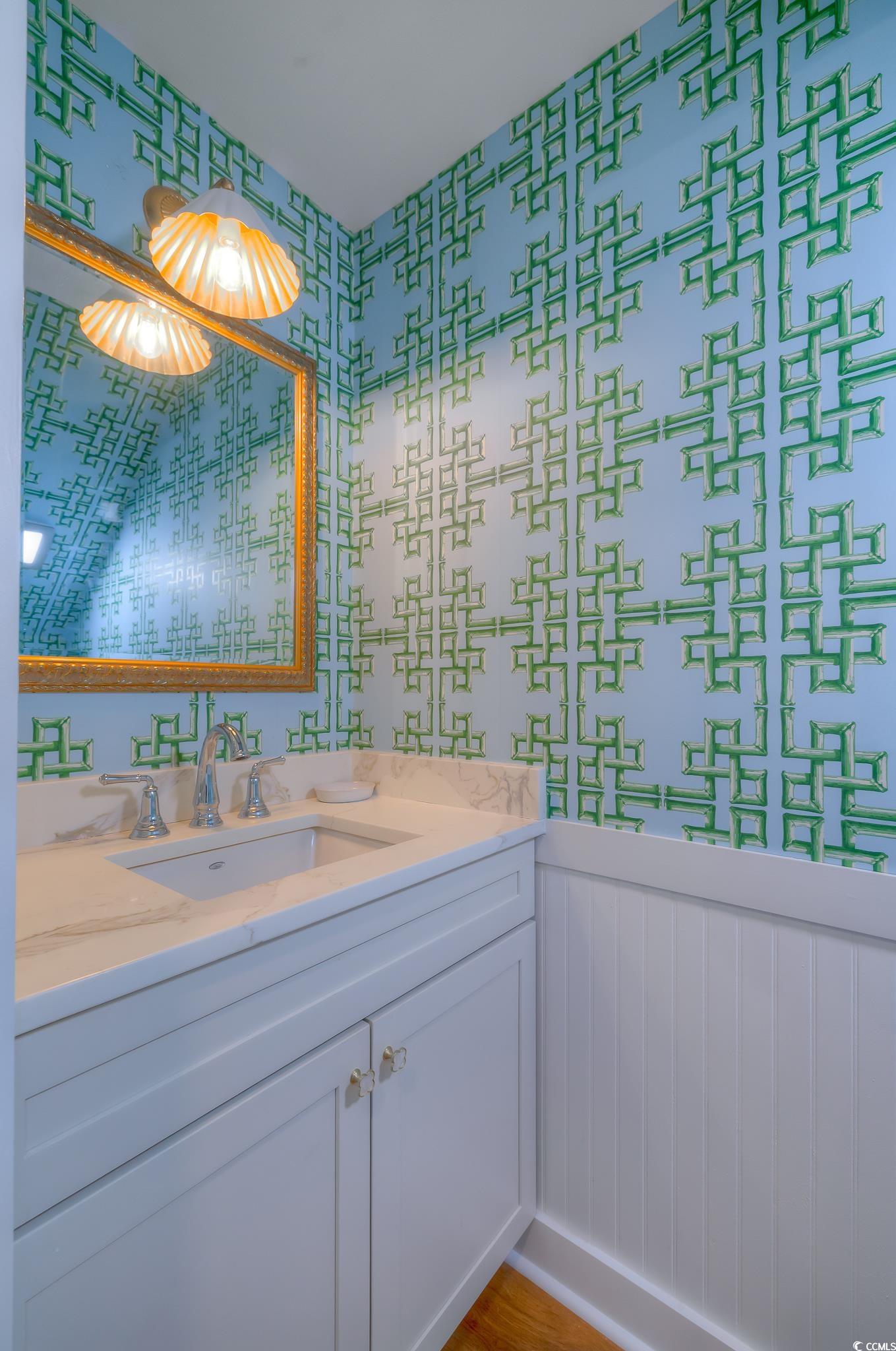 204 Bamboo Loop, Unit 202 Georgetown, SC 29440 - Photo 4 of 40 Bathroom with vanity and wallpapered walls