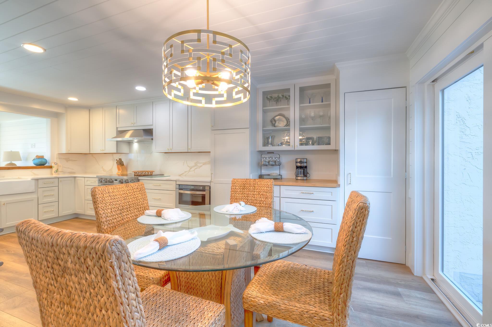 204 Bamboo Loop, Unit 202 Georgetown, SC 29440 - Photo 7 of 40 Dining space with recessed lighting, light wood-style floors, and a chandelier