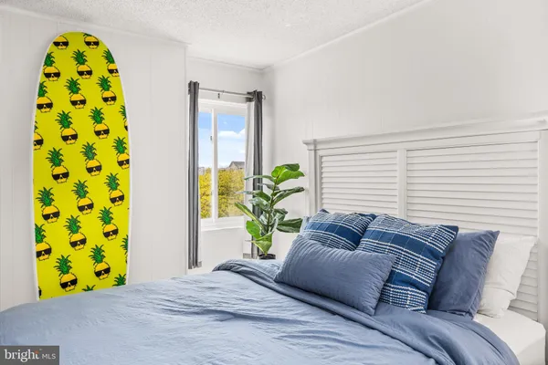 a living room with a bed and a couch
