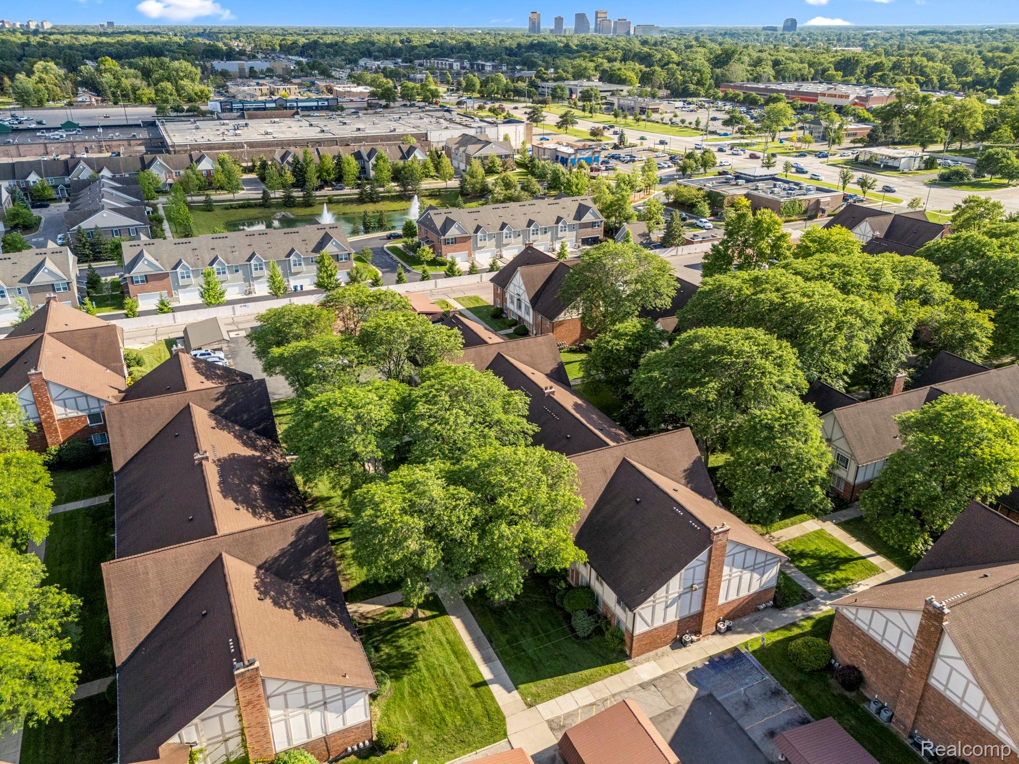 30220 Southfield Road Southfield, MI 48076 - Photo 12 of 13 Aerial perspective showcasing a residential community with brown shingled roofs and green landscaping