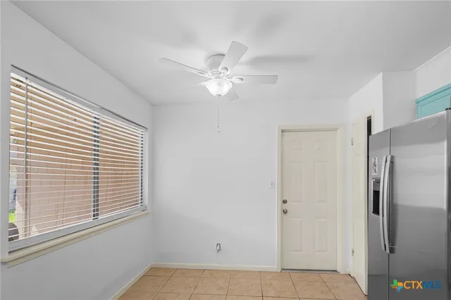 a kitchen with a stove a sink and a refrigerator