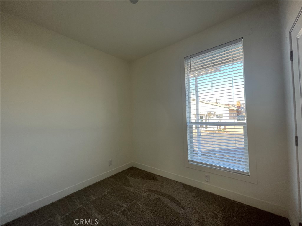 12995 6th Street, Unit 9 Yucaipa, CA 92399 - Photo 24 of 32 a view of an empty room with a window