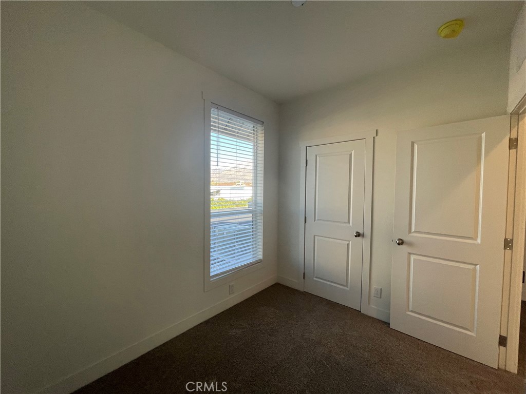 12995 6th Street, Unit 9 Yucaipa, CA 92399 - Photo 25 of 32 a view of an empty room with closet area