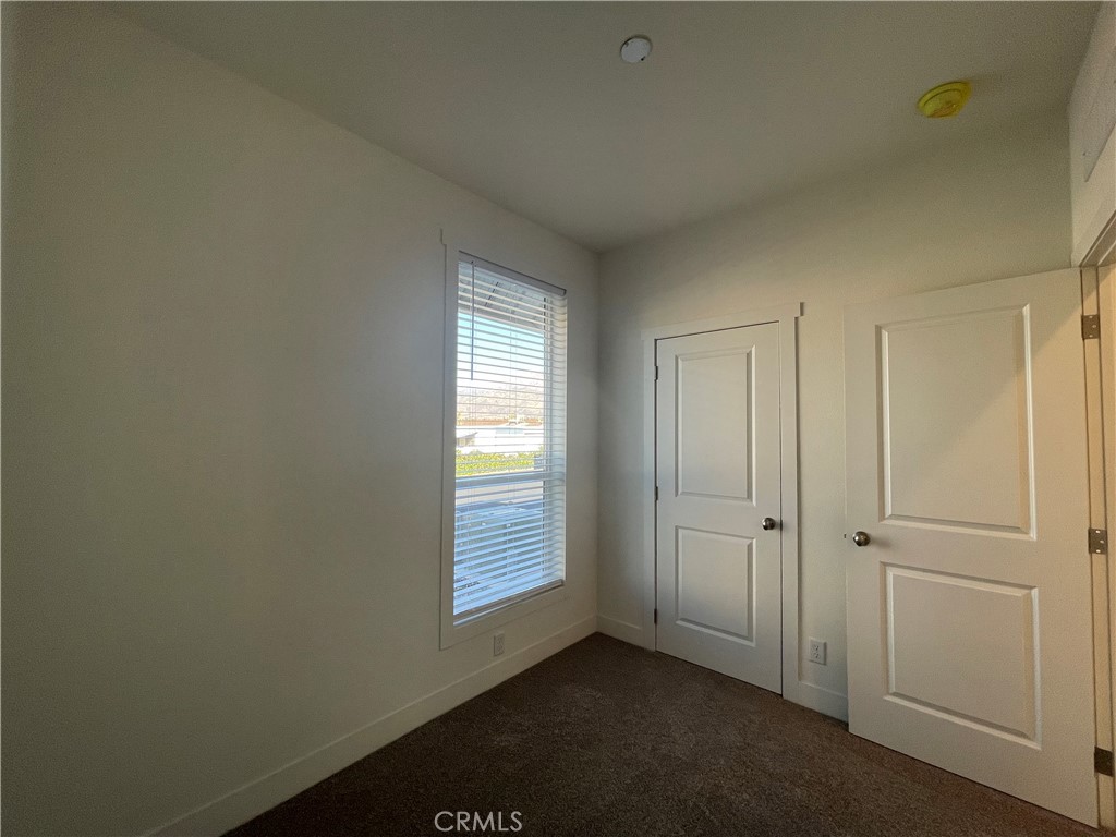 12995 6th Street, Unit 9 Yucaipa, CA 92399 - Photo 26 of 32 a view of an empty room and window