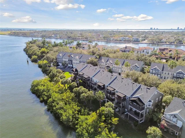 an aerial view of a house with a lake view