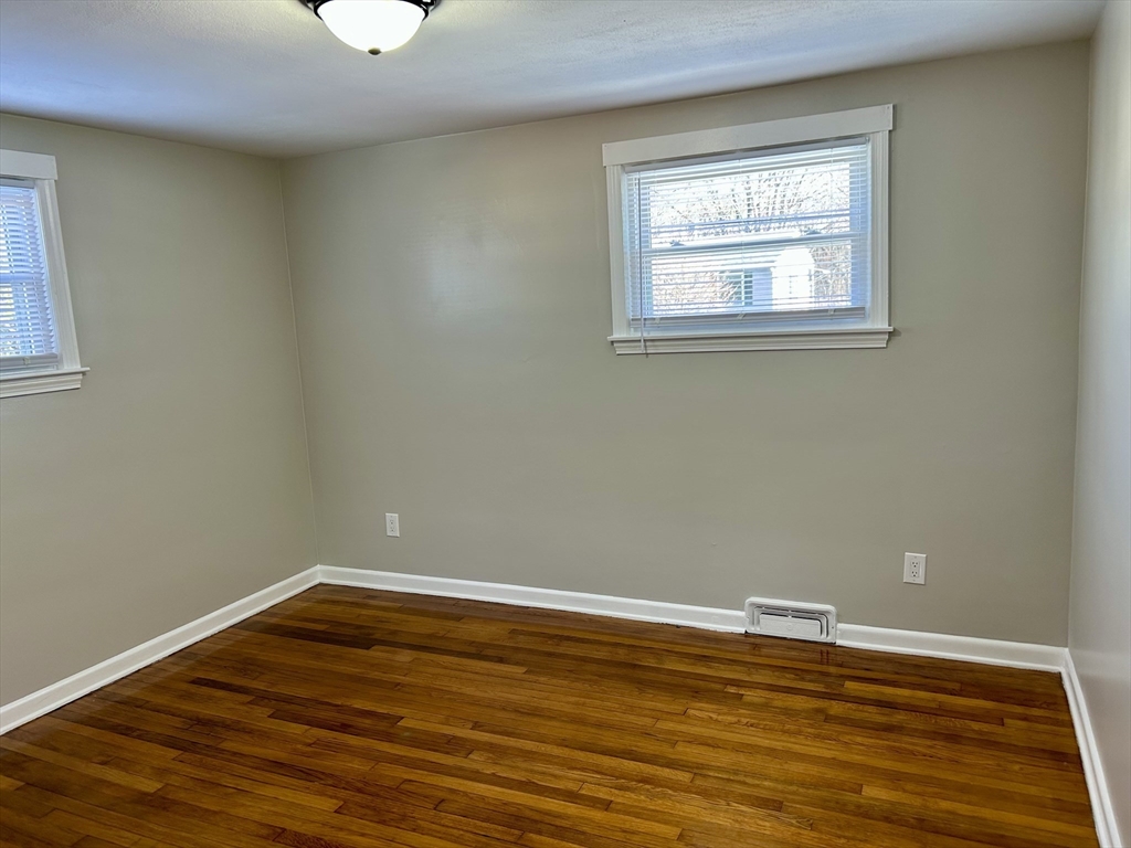 42 Talmadge Drive Springfield, MA 01118 - Photo 11 of 21 a view of a room with wooden floor and windows