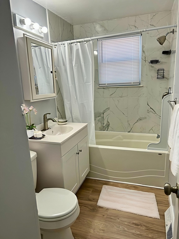 42 Talmadge Drive Springfield, MA 01118 - Photo 15 of 21 a bathroom with a sink a toilet and shower