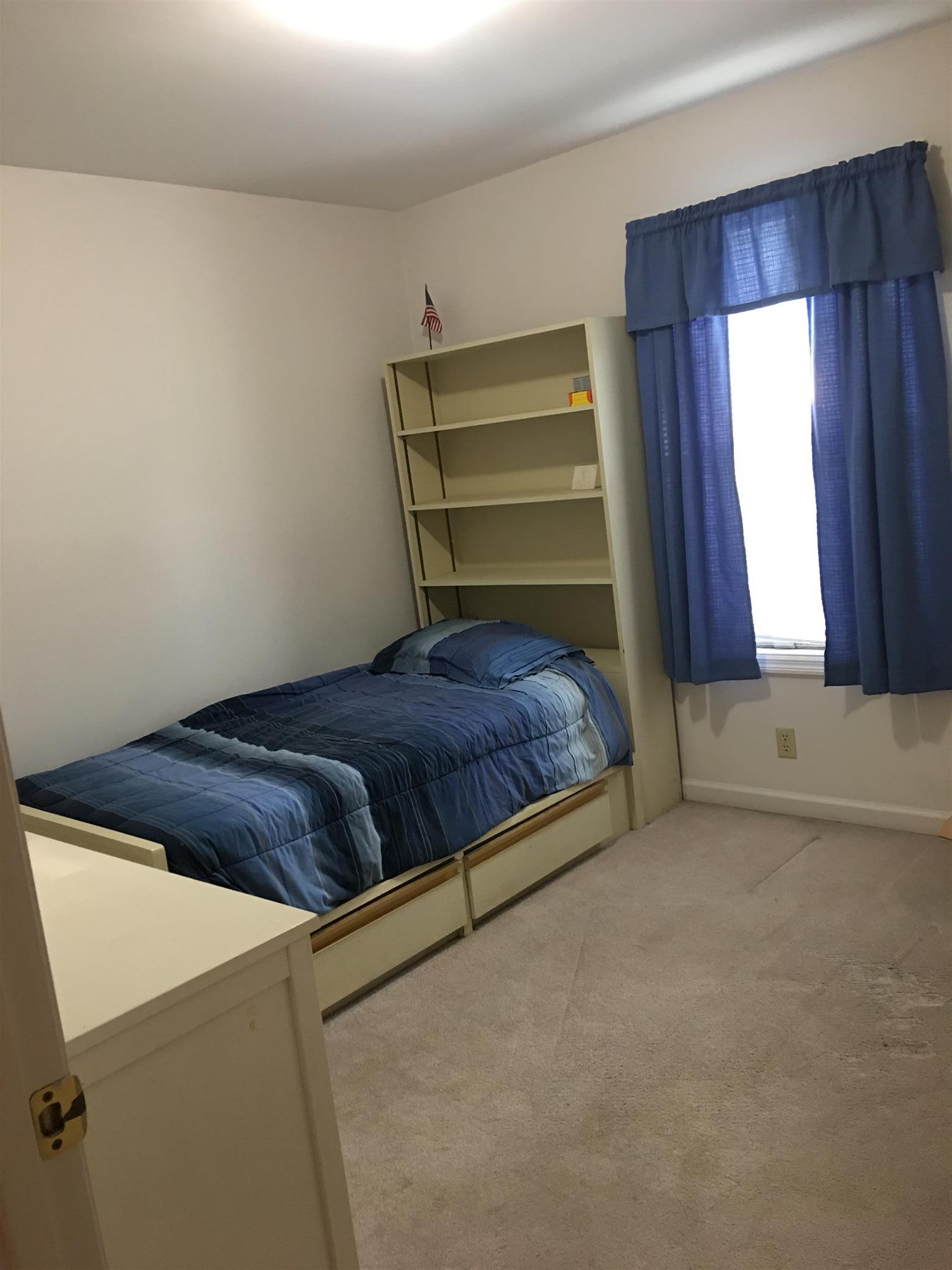 1241 Cheyenne Boulevard Madison, TN 37115 - Photo 14 of 16 a bedroom with a bed and a window