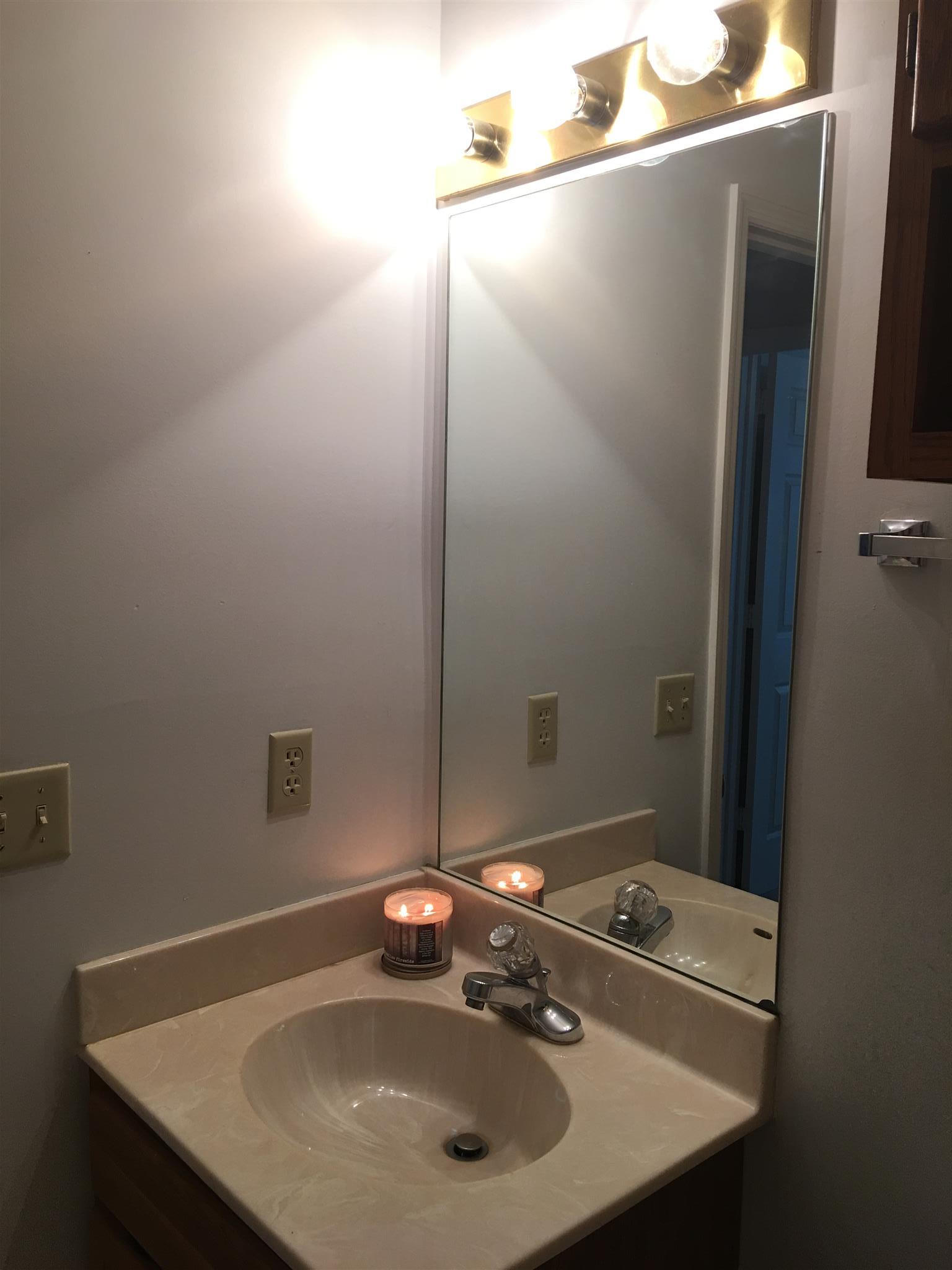 1241 Cheyenne Boulevard Madison, TN 37115 - Photo 15 of 16 a bathroom with a sink and a mirror