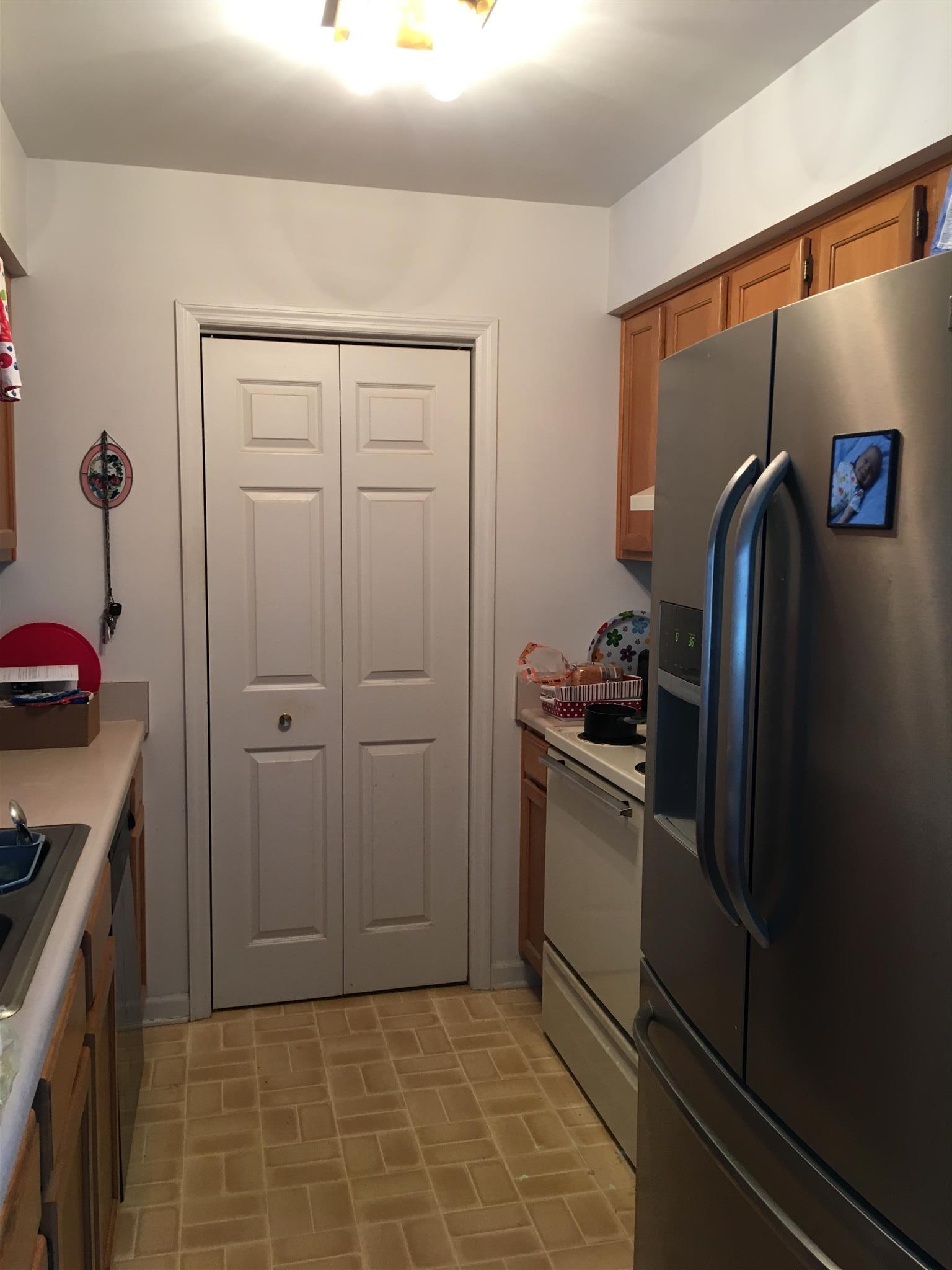 1241 Cheyenne Boulevard Madison, TN 37115 - Photo 5 of 16 a kitchen with a refrigerator and a stove top oven
