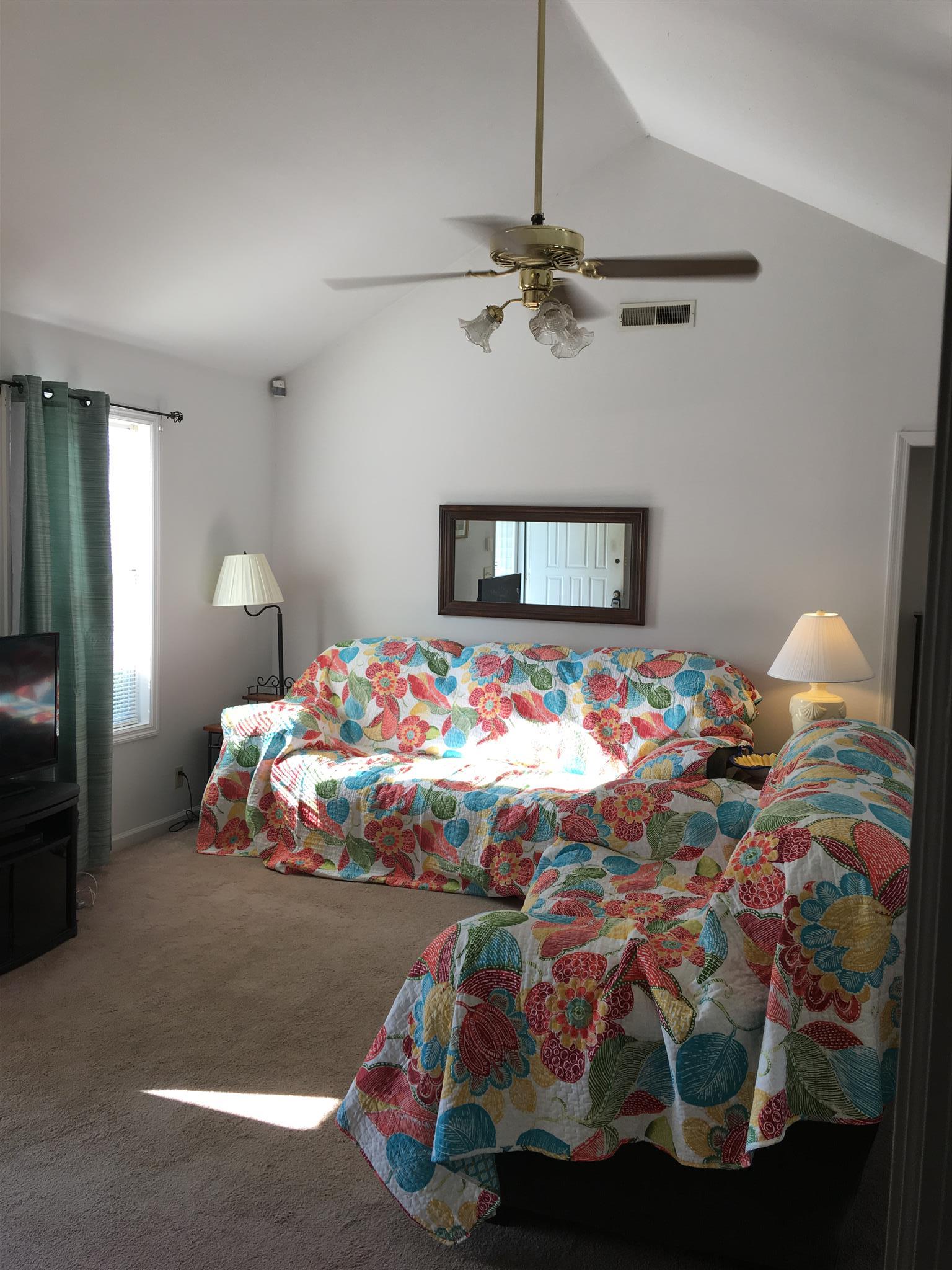 1241 Cheyenne Boulevard Madison, TN 37115 - Photo 6 of 16 a bedroom with a bed and a chandelier